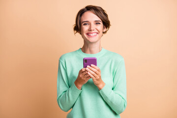 Sticker - Photo of young attractive girl happy positive smile fun joy use cellphone like post isolated over pastel color background