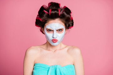 Poster - Close-up portrait of attractive mad grumpy sullen housewife wearing natural mask frowning isolated on pink pastel color background