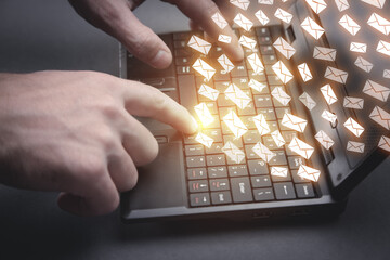 Wall Mural - male hands typing on laptop keyboard. sending email