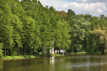 Pavilion on bank of Desna river and pedestrian bridge near Troitsk town - Troitsky administrative okrug of federal city of Moscow. Russia