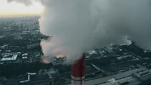 Aerial View Of The Sun Getting Obscured By Polluting Smoke From Industrial Stack. Moscow, Russia