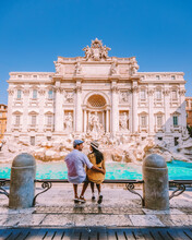 Young Couple Mid Age On A City Trip In Rome Italy Europe, Couple Sightseeing Visit Fontana Di Trevi In Rome Italy