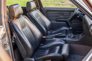Black leather sport seats of retro car