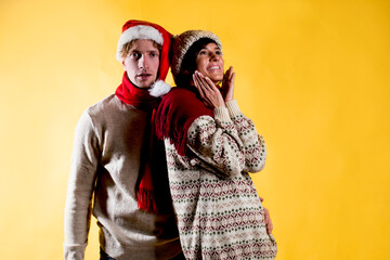 Merry fun couple girl guy in red Santa Christmas hat. Christmas couple. Fun. 