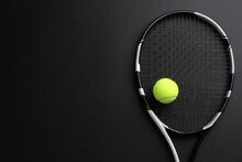 Tennis Racket And Ball On Black Background, Top View. Space For Text