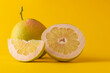 half grapefruit grapefruit and grapefruit slice isolated on yellow background