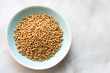 Wall Mural - Yellow Mustard Seeds in a Bowl