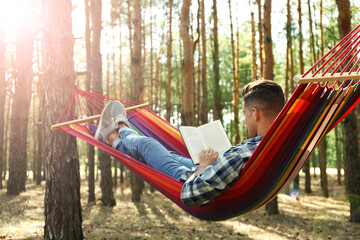 Sticker - Man with book relaxing in hammock outdoors on summer day