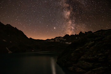 colorfull night landscape wtih star sky. astrophotography in Alps mountains