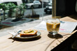 © Xavier Lorenzo/Westend61 - Cold brew coffee and cake on table at coffee shop