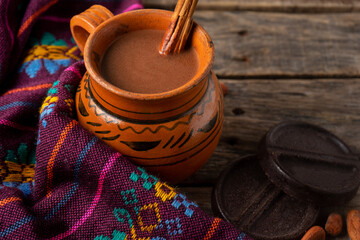 Wall Mural - Mexican hot cocoa on wooden background