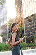 © VITTA GALLERY/Westend61 - Barcelona, Spain. Young indian business woman outdoors on business district. Business, woman, job, break, formal, youg, working, etrepreneur, millenial, beautiful,