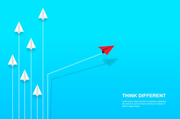 Wall Mural - Think differently concept. Red airplane changing direction. Concepts: change, unique, trend, courage, innovation, different.