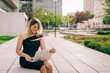 © Alexandra C. Ribeiro/Westend61 - Cheerful businesswoman using laptop outdoors