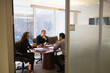 © Tetra Images/Tetra Images - Young business people having meeting in conference room