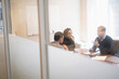 © Tetra Images/Tetra Images - Young business people having meeting in board room