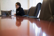 © Tetra Images/Tetra Images - Young business woman sitting in conference room with laptop
