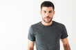 © AntonioDiaz - Portrait shot of a good-looking latin man in front of a white background