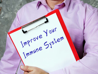 Wall Mural -  Improve Your Immune System sign on the piece of paper.