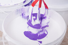Mixer Stirring Paint In A White Bucket, Top View, Close-up