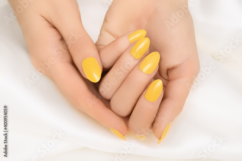 Female hand with orange nail design Fototapete