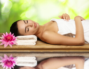 Poster - Young woman lying on wooden bench. Spa treatment