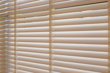 Leinwandbilder - Wood blinds closeup in the interior. Automatic venetian blinds beige color on large windows. Coulisse wooden slats 50mm wide. Wood floor, beige walls.