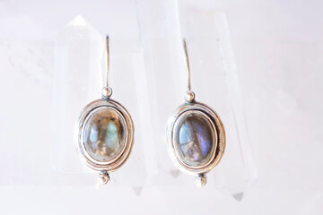 pair of sterling silver mineral earrings on natural background