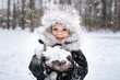 © Ольга Смоляк - Portrait of a boy in a fur winter hat. Winter, outdoor, snow