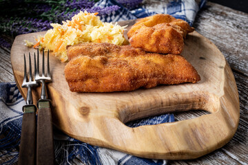 Two fried cod fillet pieces.