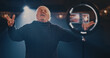 © Framestock - Aged actor recording video on theater stage