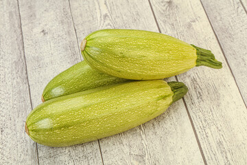 Young tasty zucchini over board