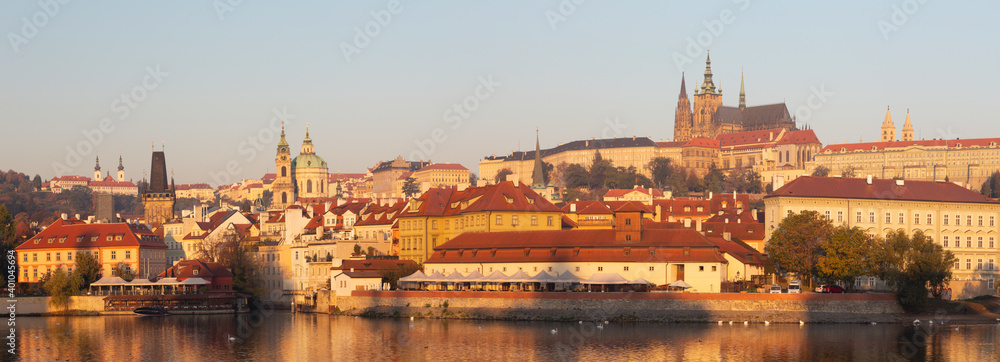 Prague - The Mala Strana, Castle and Cathedral from promenade over the  Vltava river in the morning light. - obrazy, fototapety, plakaty 