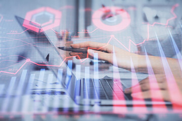 Multi exposure of woman hands typing on computer and financial graph hologram drawing. Stock market analysis concept.