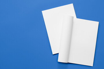 Blank magazines on color background