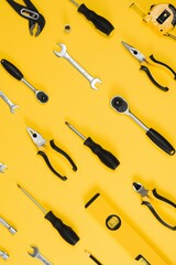 Set of various construction tools. Tools for home repair. Work at a construction site. On a yellow background. Flatly. Flatlay.