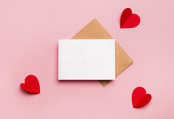 mockup blank greeting card for valentines day. composition with red hearts for valentine's day on a 