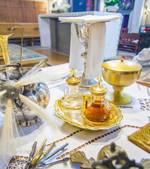 Wall Mural - chalice for wine, blood of christ, and ciborium with host, body of christ, and ampoules with wine and water for consecration