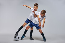 Two Boys Playing Soccer, Enjoying Sports Game, Kids In Sportive Uniform Having Fun, Kids Activities, Little Soccer Player. Isolated