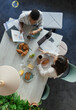 © Paul Bradbury/Caia Image - Businesswomen discussing paperwork at breakfast meeting in office