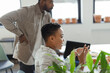 © Paul Bradbury/Caia Image - Business people talking in office meeting