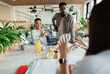 © Paul Bradbury/Caia Image - Business people talking in office meeting