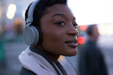 Close Up Beautiful Young Woman Listening To Music With Headphones
