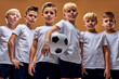 © Roman - soccer players after final game, confidently looking at camera. sports portrait of young football players. football youth junior team posing at camera