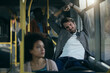 © Drazen - Exhausted man stretching while traveling by bus.