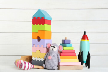 Wall Mural - Set of different toys on white wooden table