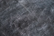 back to school: black chalkboard with blurry traces of white chalk and crayons, minor scratches