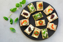 Gluten Free Crackers With Various Toppings.