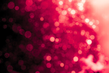 Wall Mural - Red light glowing defocused holiday blurr bokeh in black