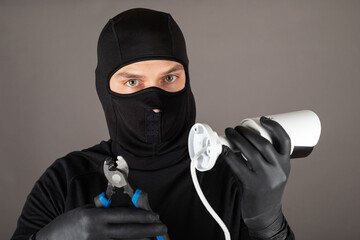 Wall Mural - Thief turning off surveillance camera